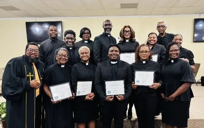 Members of the Relevant Empowerment Church family gathered together after a service